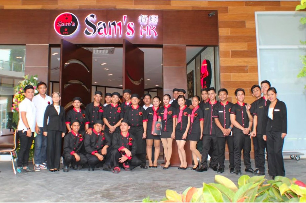 Sam's HK Team outside Restaurant Facade